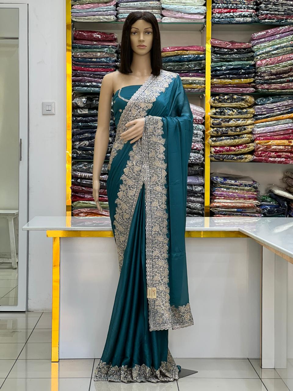 Elegant Teal Silk Saree with Heavy Silver Embroidery Border
