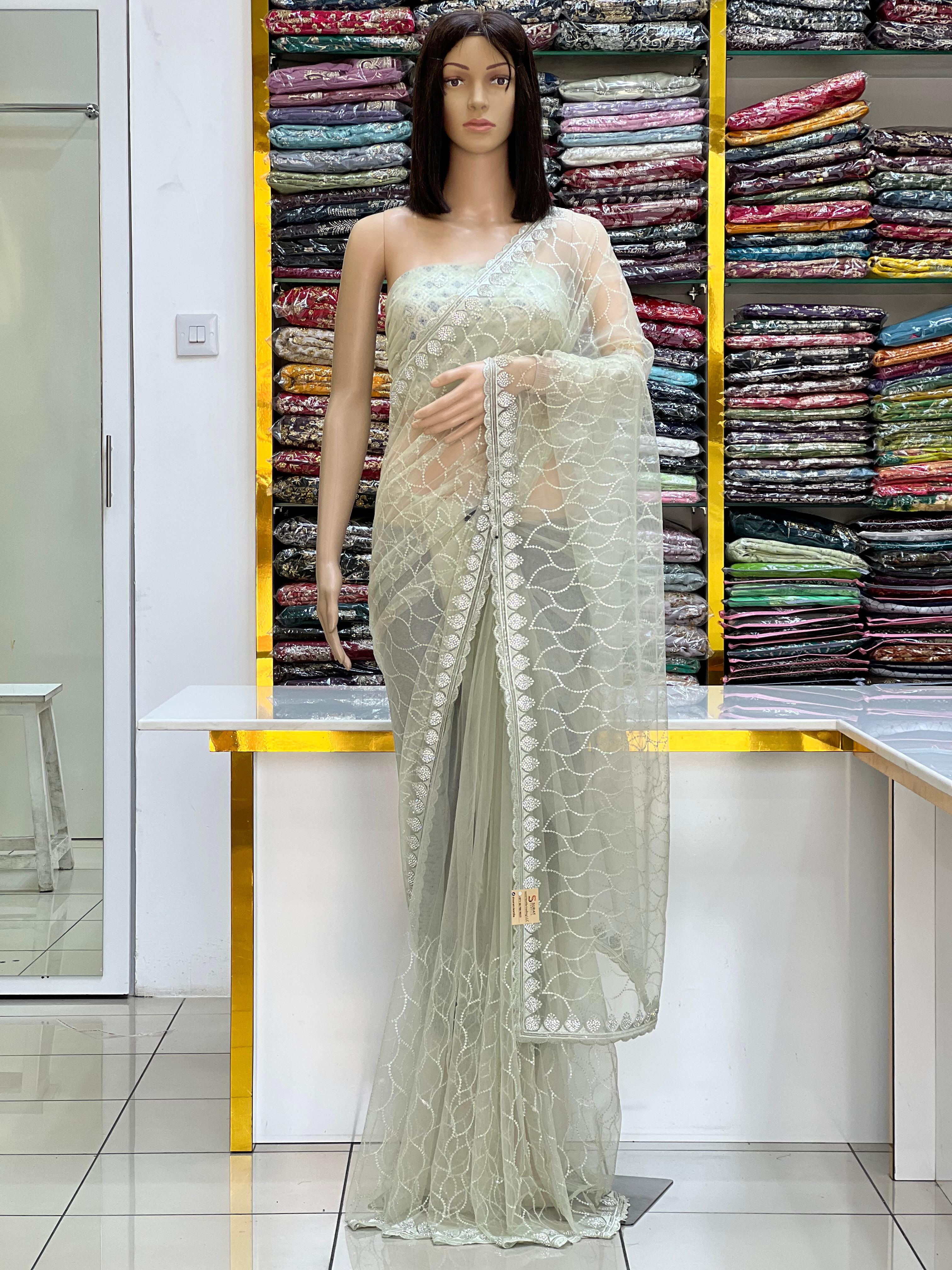 Elegant Pastel Net Saree with All-Over Embroidery & Scalloped Border