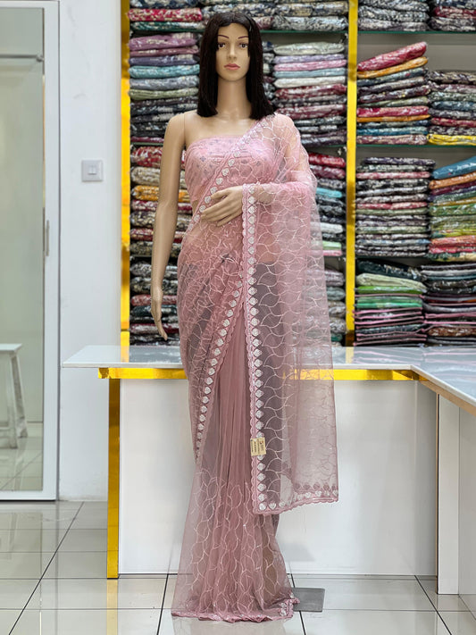 Elegant Blush Pink Net Saree with All-Over Embroidery & Fancy Border