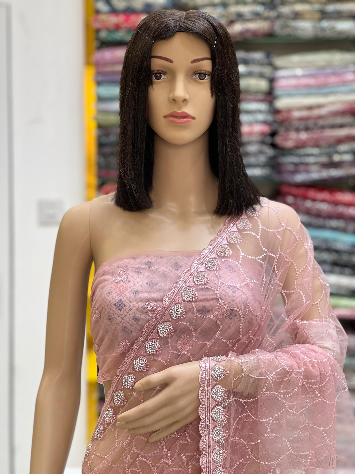 Elegant Blush Pink Net Saree with All-Over Embroidery & Fancy Border